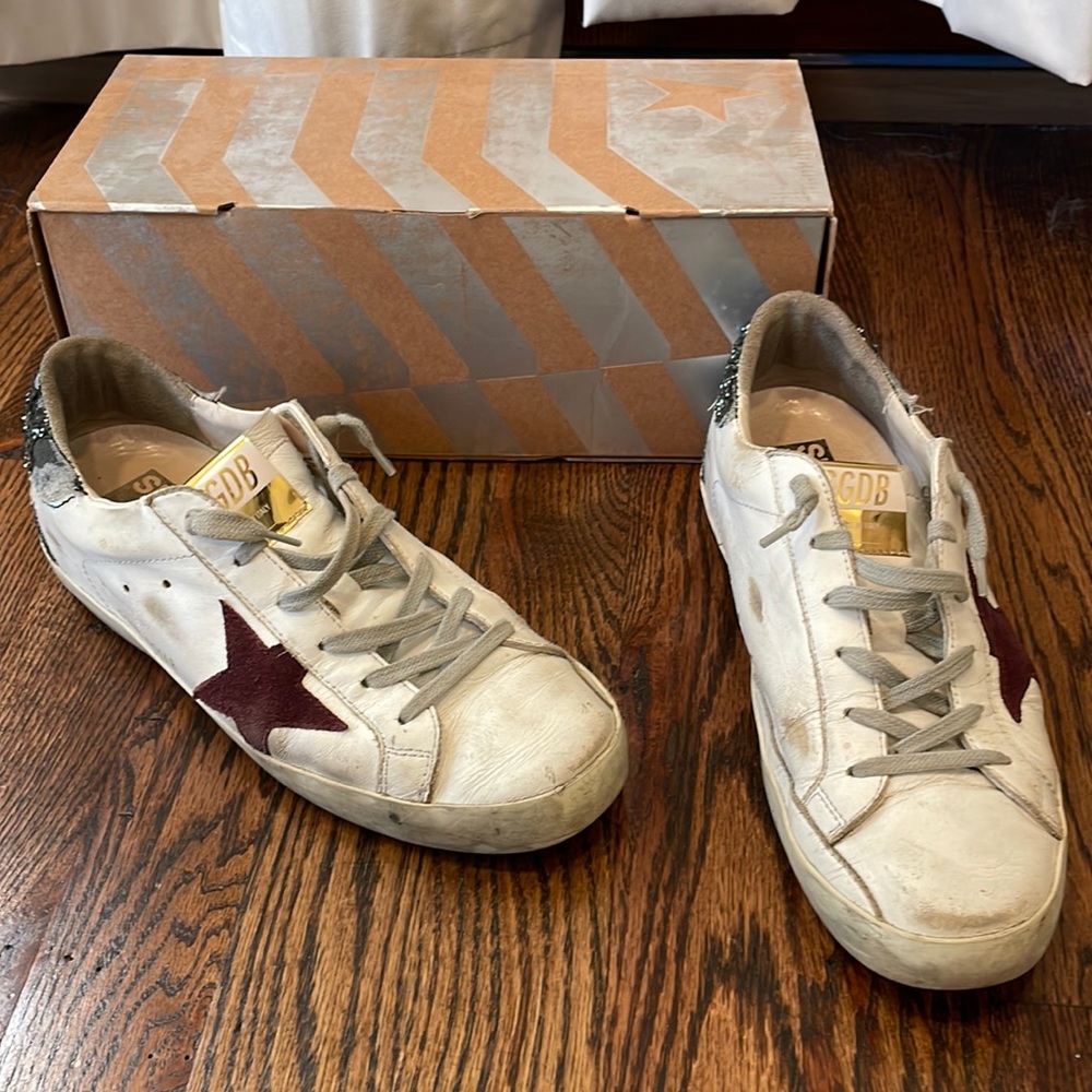 Golden Goose white sneaker with green sparkles and purple star